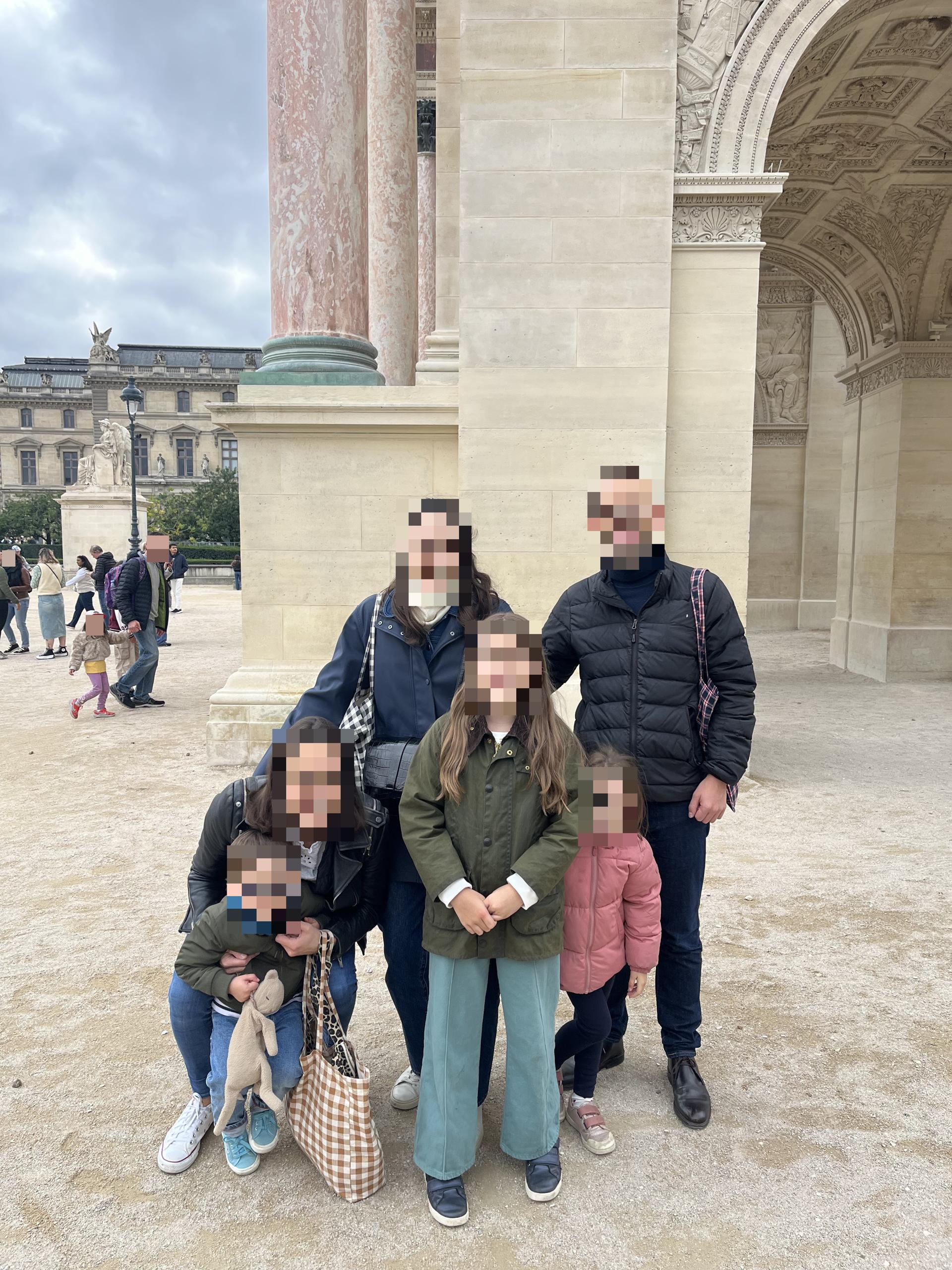 Three children on a path in the Tuileries Garden, Paris, during a family quest